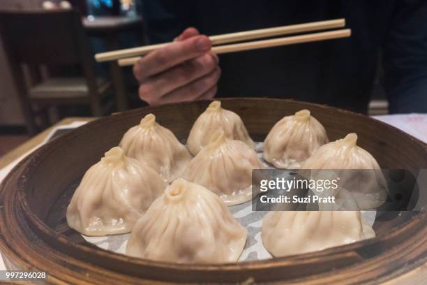 soup dumplings in macau - suzi pratt stock pictures, royalty-free photos & images