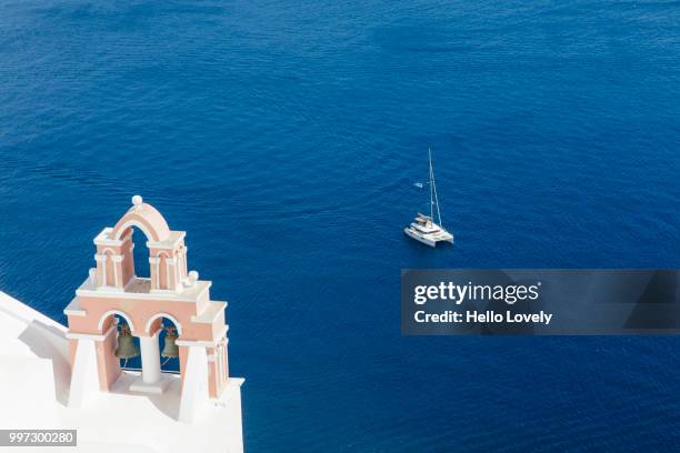 church against blue sea - catamaran sailing stock-fotos und bilder