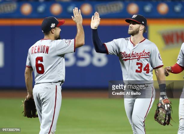 Anthony Rendon and Bryce Harper of the Washington Nationals celebrate a 5-4 win against the New York Mets during their game at Citi Field on July 12,...