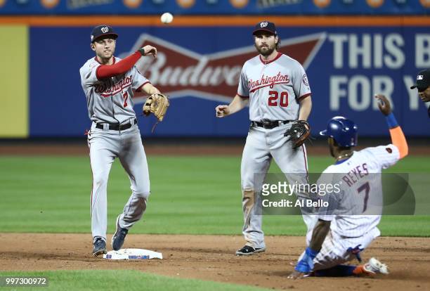 Adam Eaton of the Washington Nationals turns a double play against Jose Reyes of the New York Mets to end the game and preserve a 5-4 win during...
