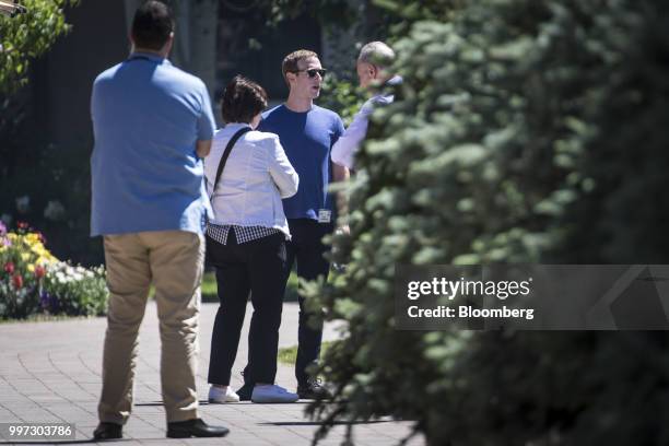 Mark Zuckerberg, chief executive officer and founder of Facebook Inc., second from right, speaks with Senate Minority Leader Chuck Schumer, a...