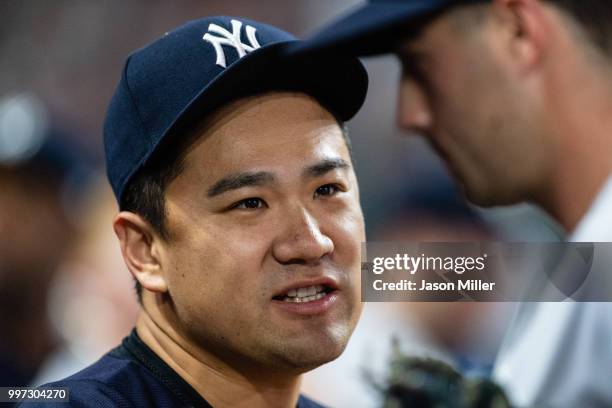 Masahiro Tanaka of the New York Yankees celebrates with teammates during the ninth inning against the Cleveland Indians at Progressive Field on July...