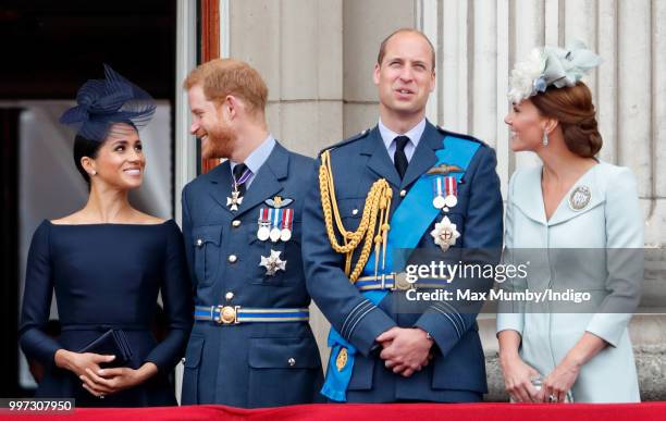 Meghan, Duchess of Sussex, Prince Harry, Duke of Sussex, Prince William, Duke of Cambridge and Catherine, Duchess of Cambridge watch a flypast to...