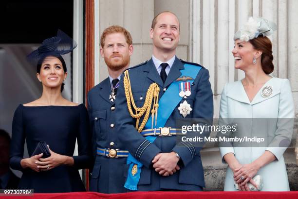 Meghan, Duchess of Sussex, Prince Harry, Duke of Sussex, Prince William, Duke of Cambridge and Catherine, Duchess of Cambridge watch a flypast to...