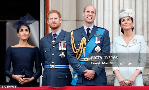 Meghan, Duchess of Sussex, Prince Harry, Duke of Sussex, Prince William, Duke of Cambridge and Catherine, Duchess of Cambridge watch a flypast to...