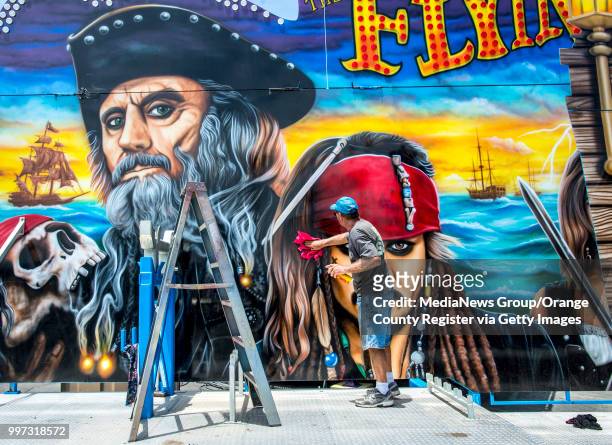 With just days before the opening of the OC Fair, Ron Haen wipes down the Flying Dutchman ride at the OC Fair on Tuesday, July 10, 2018. The fair...