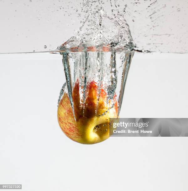 apple splash - splash crown stock pictures, royalty-free photos & images