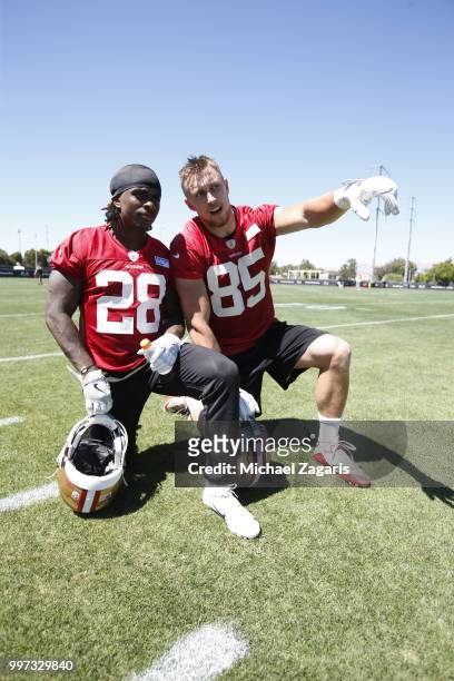 Jerick McKinnon and George Kittle of the San Francisco 49ers talk on the field during the team Mini Camp at the SAP Training Facility on June 12,...
