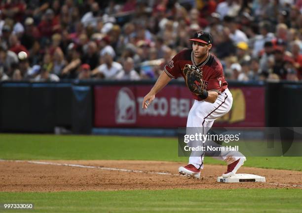 Paul Goldschmidt of the Arizona Diamondbacks catches a throw while covering first base against the San Diego Padres at Chase Field on July 8, 2018 in...