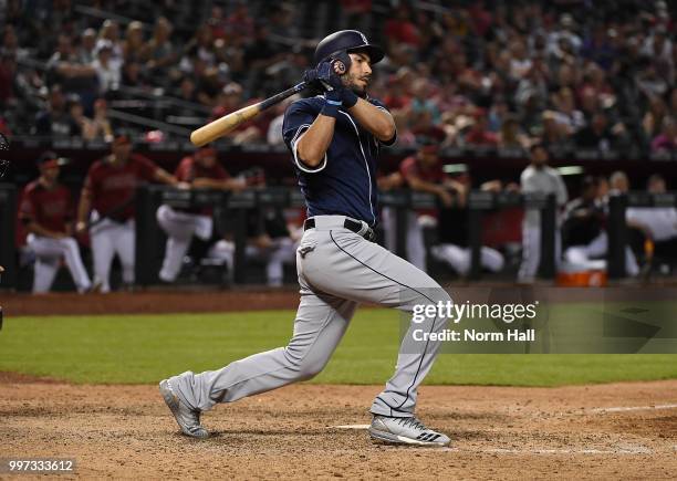 Eric Hosmer of the San Diego Padres follows through on a swing against the Arizona Diamondbacks at Chase Field on July 8, 2018 in Phoenix, Arizona.