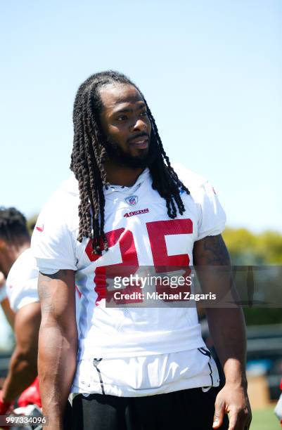 Richard Sherman of the San Francisco 49ers stands on the field during the team Mini Camp at the SAP Training Facility on June 12, 2018 in Santa...