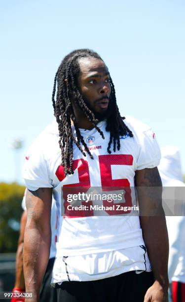 Richard Sherman of the San Francisco 49ers stands on the field during the team Mini Camp at the SAP Training Facility on June 12, 2018 in Santa...