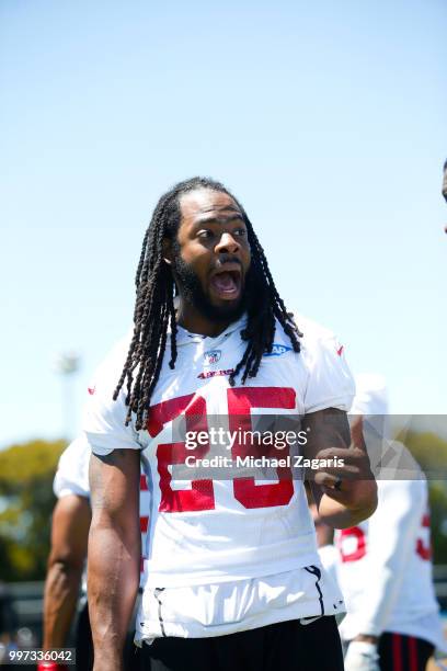 Richard Sherman of the San Francisco 49ers stands on the field during the team Mini Camp at the SAP Training Facility on June 12, 2018 in Santa...