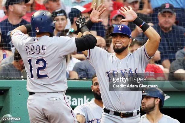 Rougned Odor of the Texas Rangers returns to the dugout after hitting a solo home run in the second inning of a game against the Boston Red Sox at...