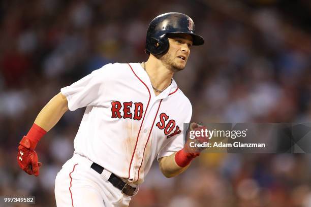 Andrew Benintendi of the Boston Red Sox runs to first base during a game against the Texas Rangers at Fenway Park on July 10, 2018 in Boston,...