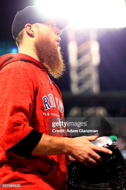 Craig Kimbrel of the Boston Red Sox walks towards yeti bullpen during a game against the Texas Rangers at Fenway Park on July 10, 2018 in Boston,...