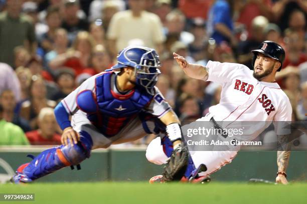 Blake Swihart of the Boston Red Sox slides safely into home past the tag of Isiah Kiner-Falefa of the Texas Rangers in the sixth inning of a game at...