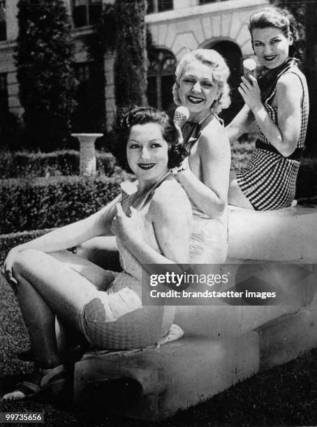 Three young actresses enjoying some ice-cream in the summer heat. Hollywood. USA. Photograph. Around 1930.
