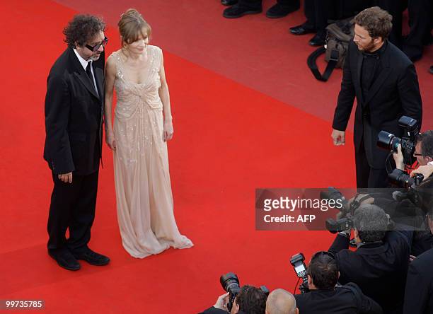 Director and president of the jury Tim Burton and French actress Isabelle Huppert arrive for the screening of "Biutiful" presented in competition at...
