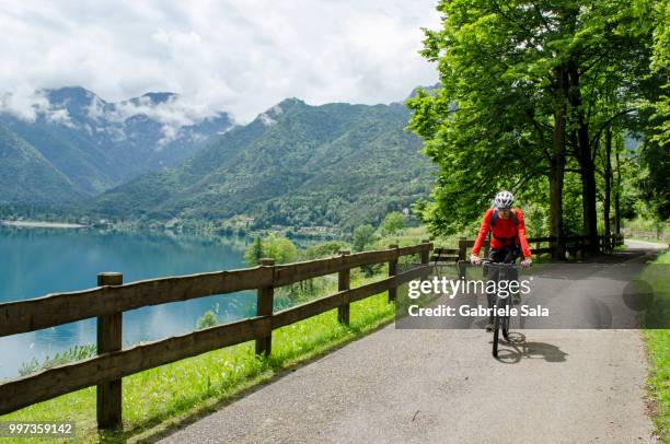 mountain biking on giro del lago di ledro trail 1 - sala stock pictures, royalty-free photos & images
