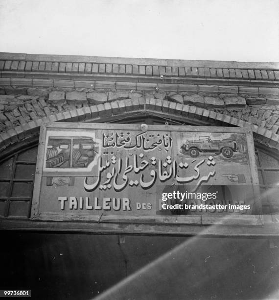 Advertisement of a car mechanic in Iran. Photograph by Ludwig baron Kummer. Around 1935.