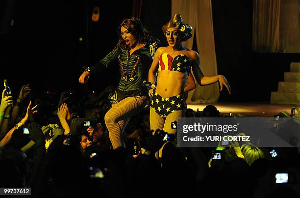 Two transvestites -- one acting as US singer Beyonce -- perform at "Bar Oh!!!" during an event called "Time of Revolution", in San Jose, Costa Rica,...