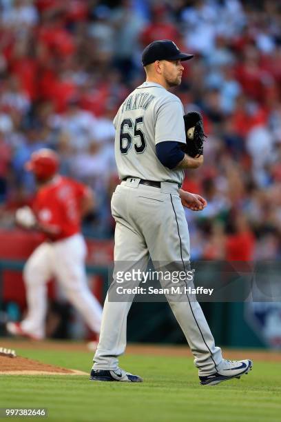 James Paxton of the Seattle Mariners looks on after allowing a two-run homerun to Albert Pujols of the Los Angeles Angels of Anaheim during the first...