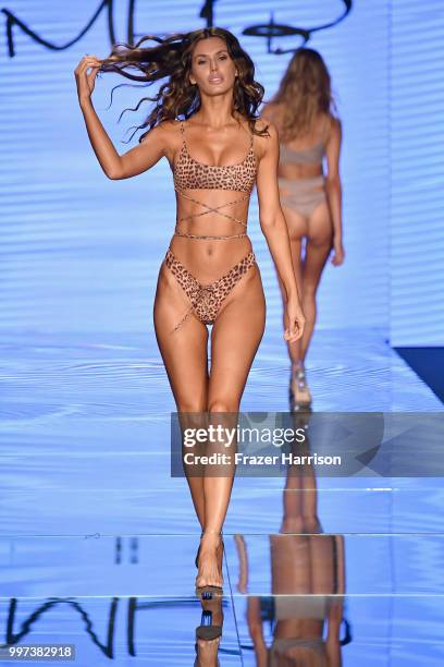 Model walks the runway for Monica Hansen during the Paraiso Fashion Fair at The Paraiso Tent on July 12, 2018 in Miami Beach, Florida.