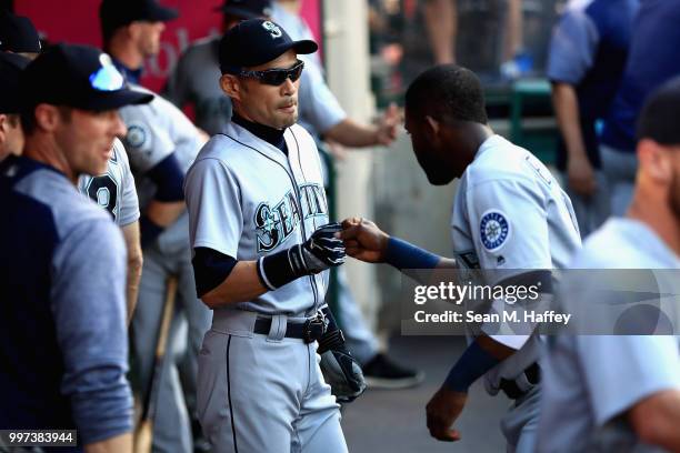 Ichiro Suzuki talks with Guillermo Heredia of the Seattle Mariners prior to a game against the Los Angeles Angels of Anaheim at Angel Stadium on July...