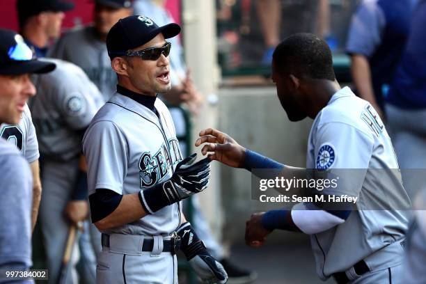 Ichiro Suzuki talks with Guillermo Heredia of the Seattle Mariners prior to a game against the Los Angeles Angels of Anaheim at Angel Stadium on July...