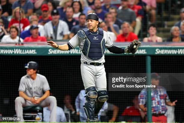 New York Yankees catcher Austin Romine with the baseball after catching a foul ball hit by Cleveland Indians designated hitter Edwin Encarnacion for...