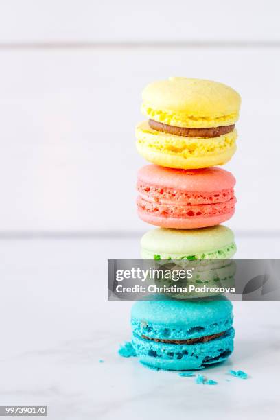 colored macaroons - coconut macaroons stock pictures, royalty-free photos & images