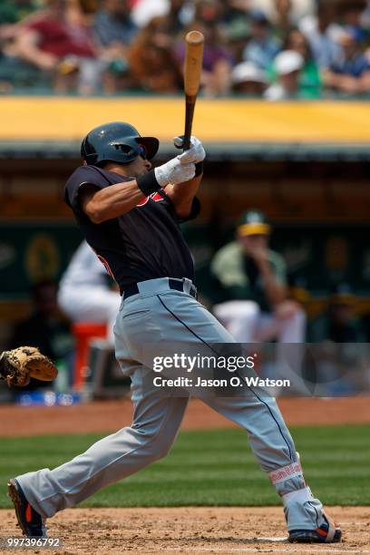 Michael Brantley of the Cleveland Indians at bat against the Oakland Athletics during the third inning at the Oakland Coliseum on July 1, 2018 in...