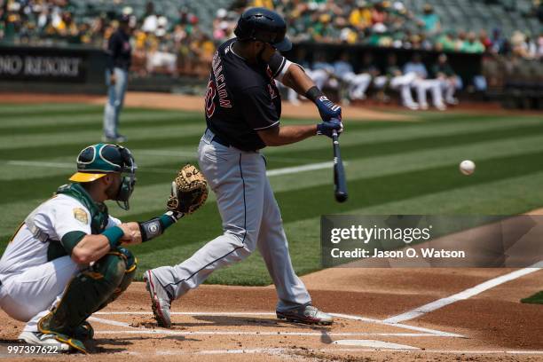 Edwin Encarnacion of the Cleveland Indians at bat against the Oakland Athletics during the first inning at the Oakland Coliseum on July 1, 2018 in...