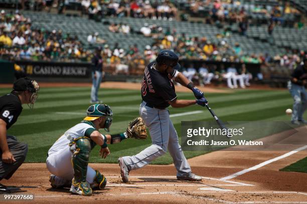 Edwin Encarnacion of the Cleveland Indians at bat against the Oakland Athletics during the first inning at the Oakland Coliseum on July 1, 2018 in...