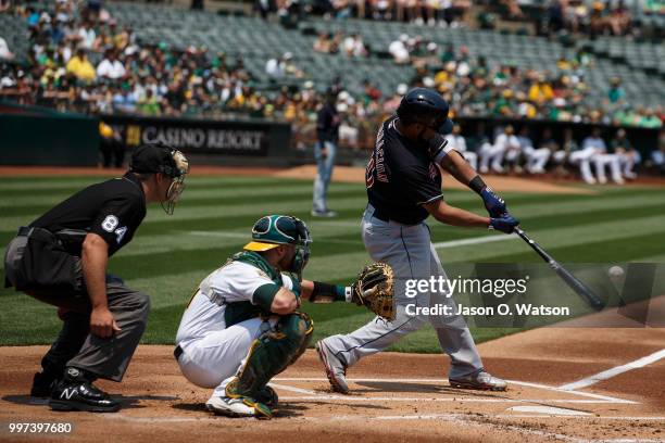 Edwin Encarnacion of the Cleveland Indians at bat against the Oakland Athletics during the first inning at the Oakland Coliseum on July 1, 2018 in...