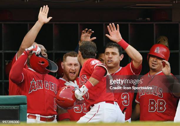 Los Angeles Angels of Anaheim third baseman David Fletcher is greeted in the dugout after Fletcher hit a leadoff solo home run in the first inning of...