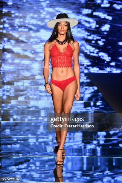 Model walks the runway for Baes & Bikinis during the Paraiso Fashion Fair at The Paraiso Tent on July 12, 2018 in Miami Beach, Florida.