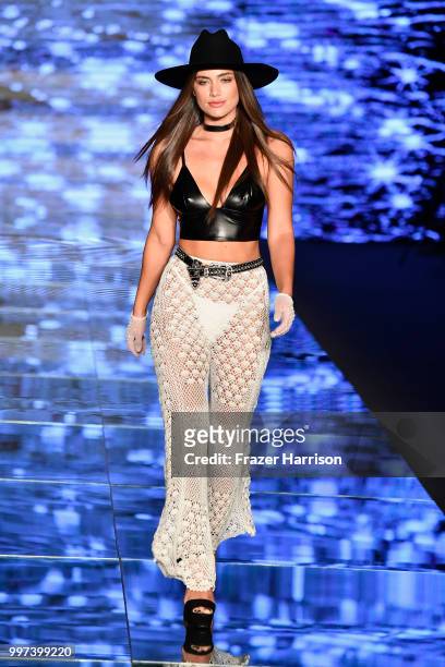 Model walks the runway for Baes & Bikinis during the Paraiso Fashion Fair at The Paraiso Tent on July 12, 2018 in Miami Beach, Florida.