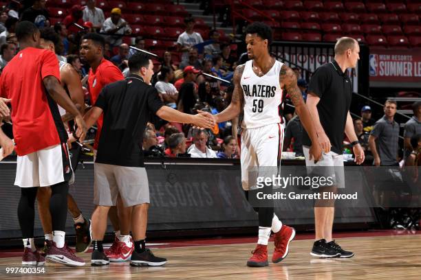 McDaniels of the Portland Trail Blazers high-fives teammates during the game against the Atlanta Hawks during the 2018 Las Vegas Summer League on...
