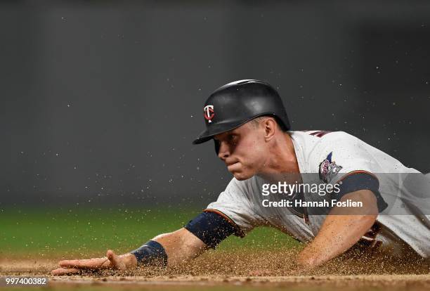Max Kepler of the Minnesota Twins slides safely into third base against the Tampa Bay Rays during the second inning of the game on July 12, 2018 at...
