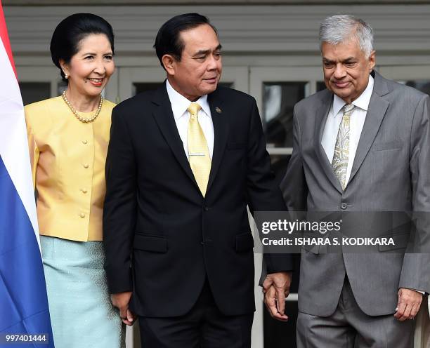 Sri Lanka's Prime Minister Ranil Wickremesinghe , Thailand's Prime Minister Prayut Chan-O-Cha and his wife Naraporn attend a meeting at the prime...