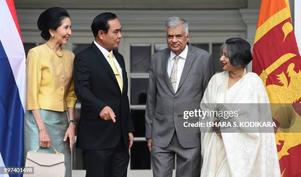 Sri Lanka's Prime Minister Ranil Wickremesinghe , his wife Maithree , Thailand's Prime Minister Prayut Chan-O-Cha and his wife Naraporn prepare for a...