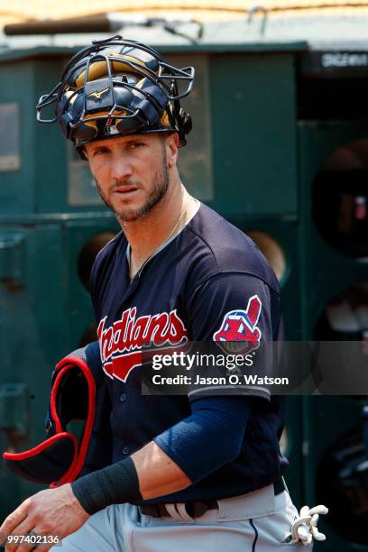 Yan Gomes of the Cleveland Indians stands in the dugout before the game against the Oakland Athletics at the Oakland Coliseum on July 1, 2018 in...