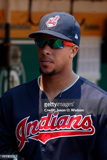 Michael Brantley of the Cleveland Indians stands in the dugout before the game against the Oakland Athletics at the Oakland Coliseum on July 1, 2018...