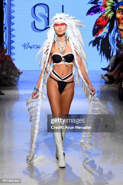 Model walks the runway for Silvia Ulson at Miami Swim Week powered by Art Hearts Fashion Swim/Resort 2018/19 at Faena Forum on July 12, 2018 in Miami...