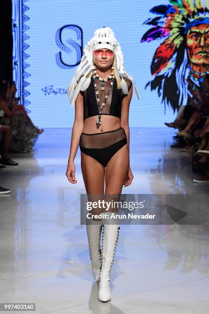 Model walks the runway for Silvia Ulson at Miami Swim Week powered by Art Hearts Fashion Swim/Resort 2018/19 at Faena Forum on July 12, 2018 in Miami...