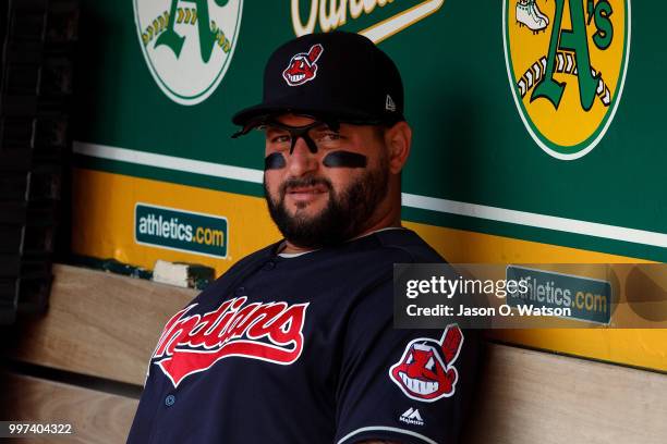 Yonder Alonso of the Cleveland Indians sits in the dugout before the game against the Oakland Athletics at the Oakland Coliseum on July 1, 2018 in...