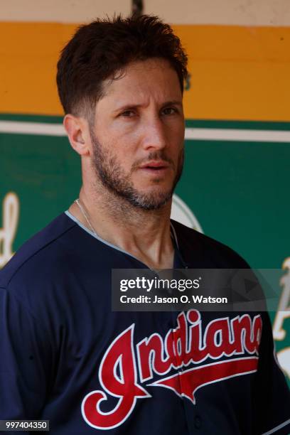 Yan Gomes of the Cleveland Indians stands in the dugout before the game against the Oakland Athletics at the Oakland Coliseum on July 1, 2018 in...