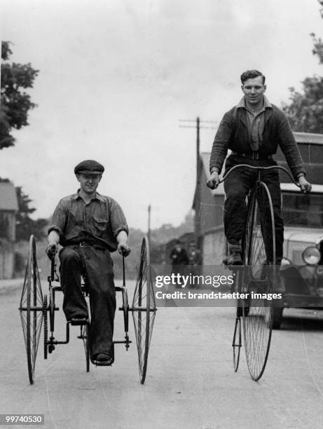 Penny Farthing and Tricycle. The picture shows two men riding a penny-farthing and a tricycle, in which the rider sits between two large wheels....